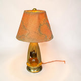 A 1:12 miniature scale table lamp with world map shade by Brooke Tucker