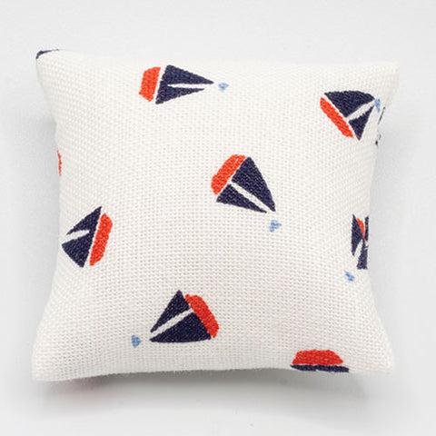 White Pillow with Bue and Red Sailboats