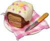 Spice Cake on White Plate with Knife