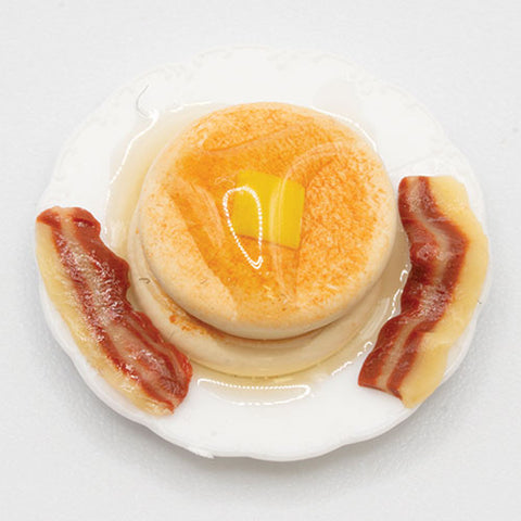 Pancakes with Butter, Syrup and Bacon on a Plate