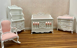 A 1:12 miniature scale nursery set, white with pink and white check