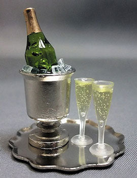 Bucket of Champagne and Two Filled Flutes on a Tray