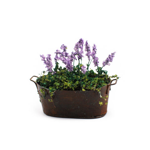 Rustic Copper Planter with Purple Flowers